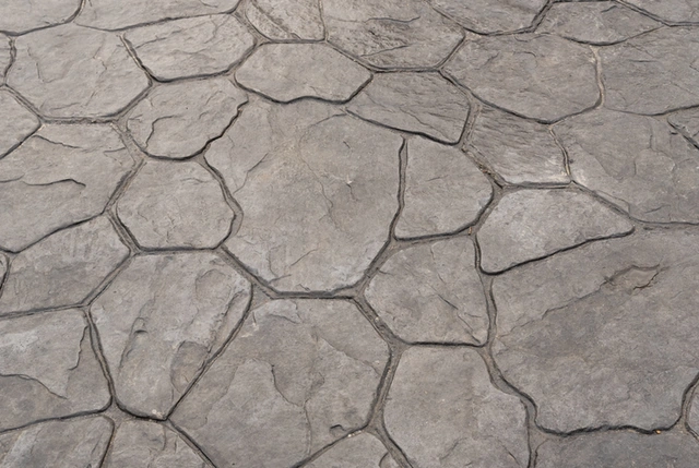 Decorative concrete surface with a stamped stone pattern